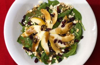 Festive Pear & Blue Cheese Salad is a pretty and delicious salad that is tossed with a homemade balsamic vinaigrette. | thetopknotkitchen.com #thetopknotkitchen #salad